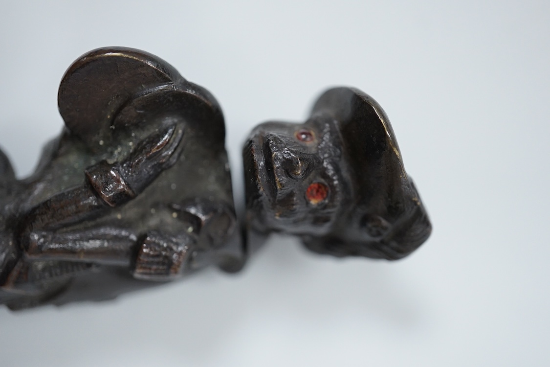 A novelty dog's head Pastille burner and bronze monkey, largest 11cm wide